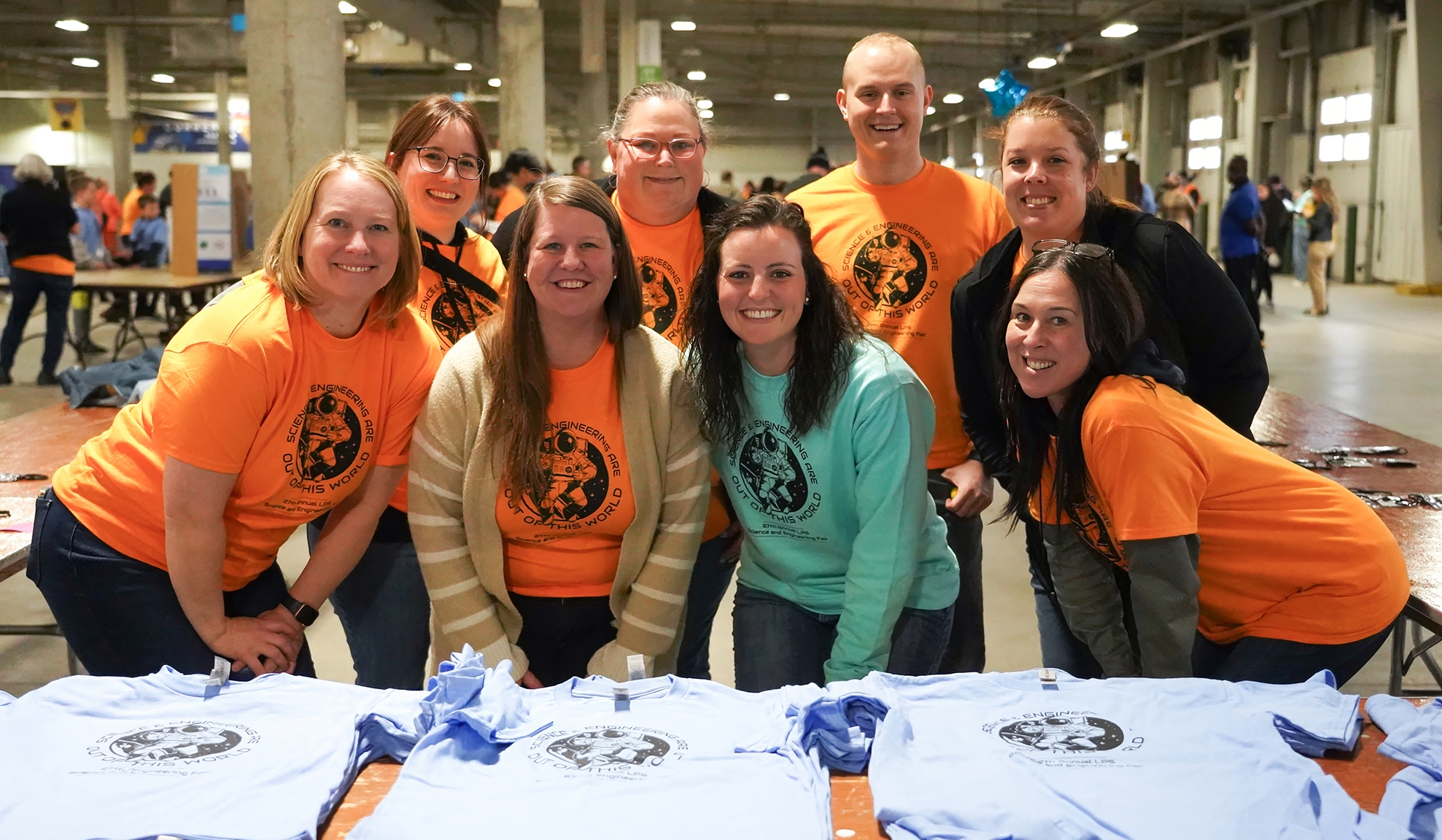 Employees volunteering at science fair